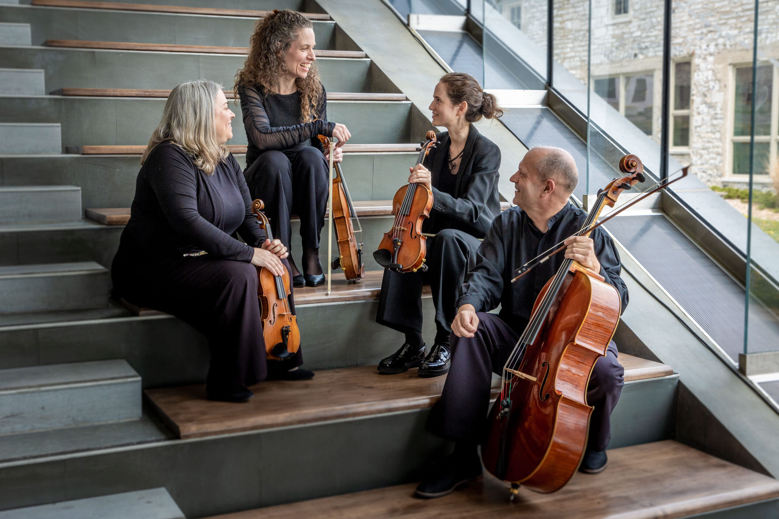 A photo of the Isabel String Quartet members in the Isabel Bader Centre